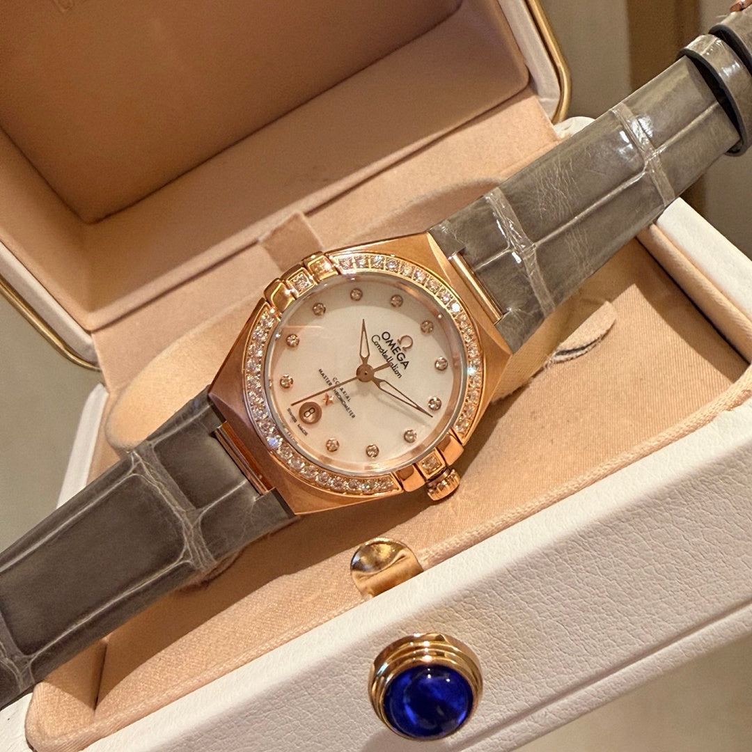 Omega wristwatch with white dial, rose-gold case, gray leather strap, crystal bezel