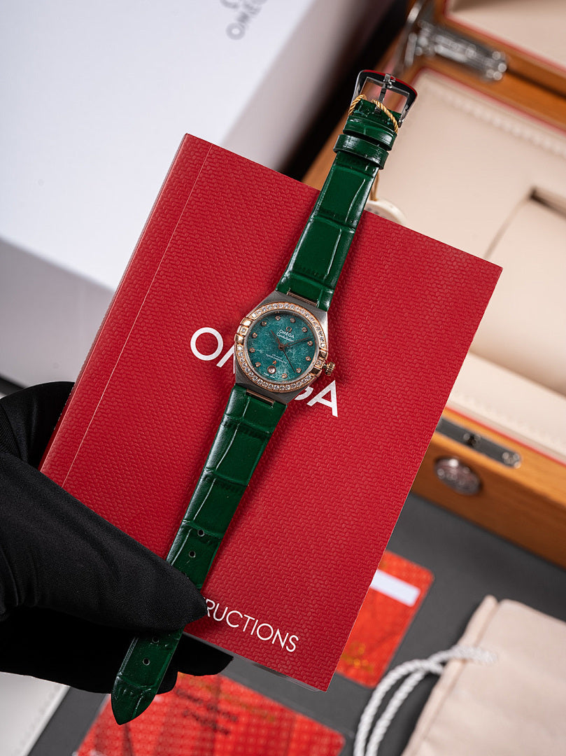 Omega wristwatch with green dial, green leather strap and clasp, held by black glove