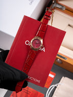 Wristwatch with red leather strap and round red dial in red gift box