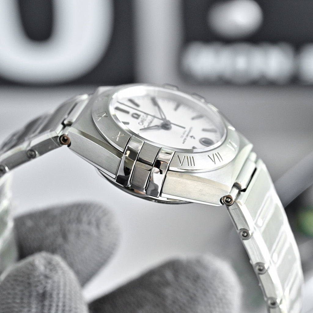Omega Constellation wristwatch with silver case and bracelet, white dial and Roman numerals