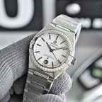 Omega Constellation wristwatch with silver bracelet, white dial, and diamond bezel