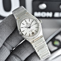 Omega Constellation wristwatch with silver bracelet, white dial, and diamond bezel
