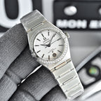 Omega Constellation wristwatch with silver bracelet, white dial, and diamond bezel