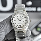 Omega Constellation wristwatch with silver bracelet, white dial, and diamond bezel