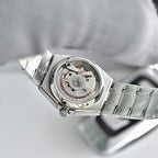 Omega Constellation wristwatch with transparent caseback showing mechanical movement