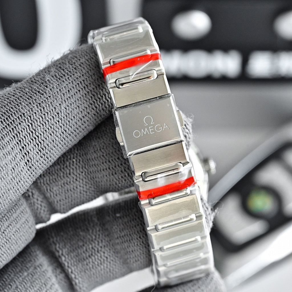 Omega Constellation wristwatch with silver bracelet and red accents on the clasp area