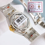 Omega watch case close-up with silver metal bracelet, marked serial on the caseback