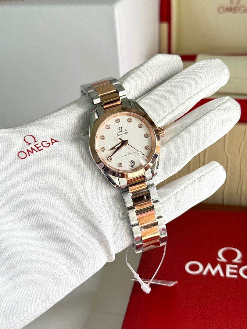 Omega wristwatch with two-tone metal bracelet and light champagne dial on white glove