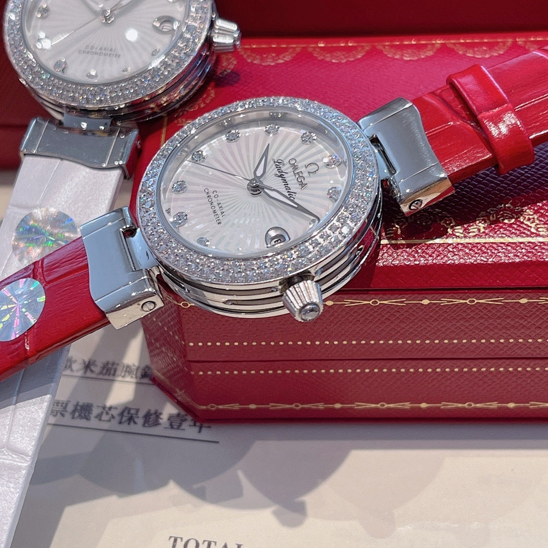 Omega wristwatch with silver-tone bezel, white dial, gray and red leather straps
