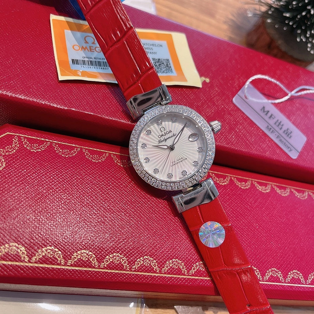 Omega wristwatch with silver-tone bezel, white dial, red leather strap