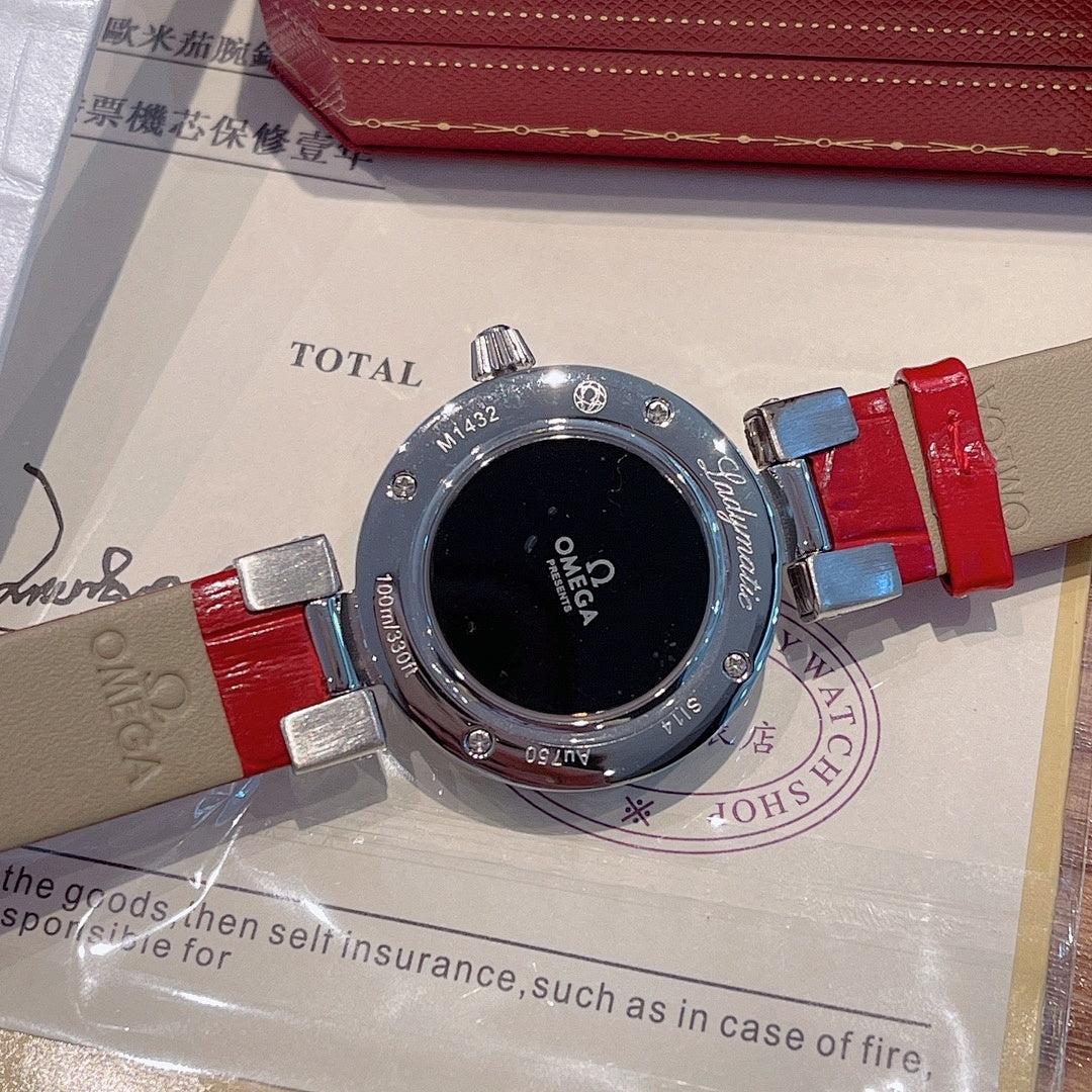 Omega wristwatch with black bezel, black dial, red and blue strap ends