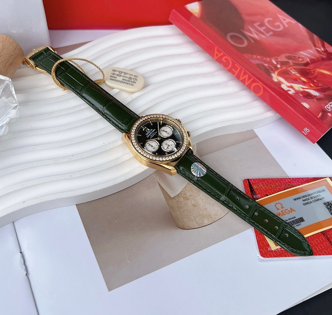 Green leather strap wristwatch with gold-tone bezel and black dial
