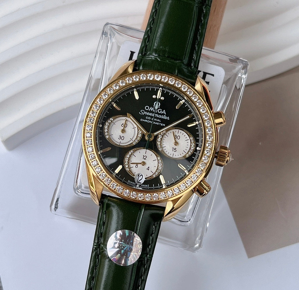 Diamond bezel wristwatch with green leather strap and gold-tone case