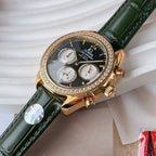 Gold-tone diamond bezel wristwatch with green leather strap, close view