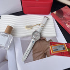 Round diamond-bezel watch with white leather strap and three subdials, on display