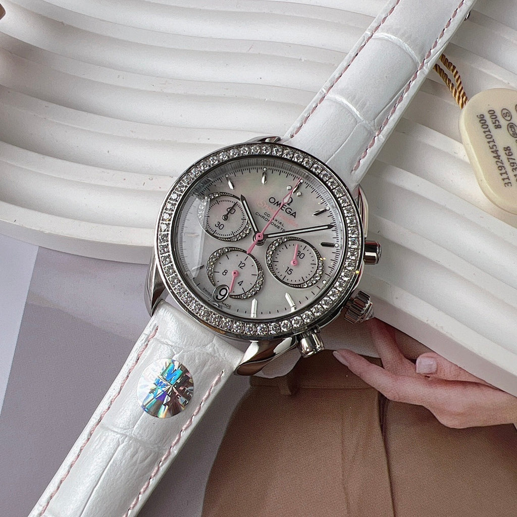 Round diamond-bezel watch with white leather strap and three subdials on silver dial