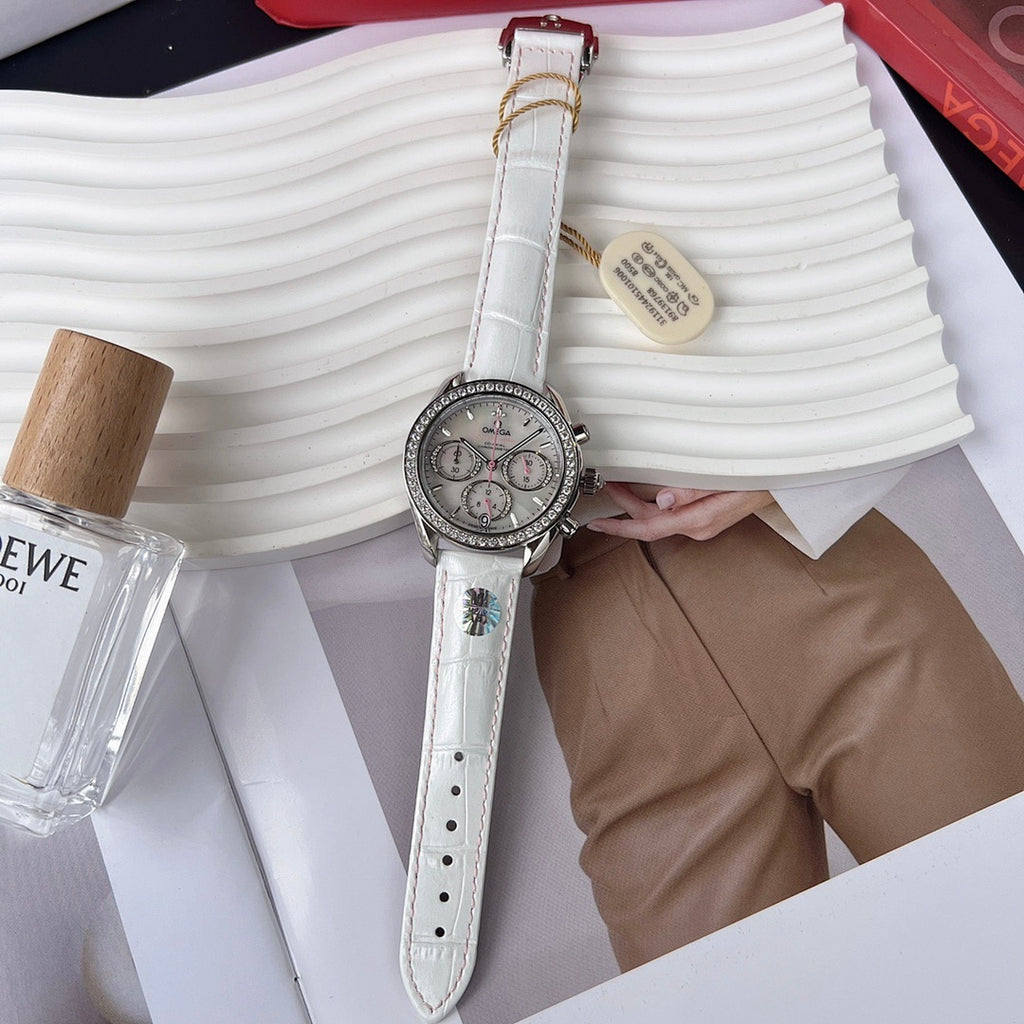 Round diamond-bezel watch with white leather strap and three subdials on a silver face