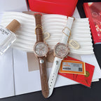 Omega watch pair, brown and white leather straps; rose-gold and silver-tone cases