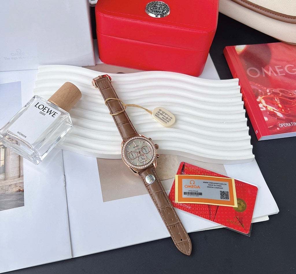 Omega watch with brown leather strap and rose-gold case; silver dial with subdials