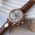 Omega watch, brown leather strap; diamond bezel; silver dial with three subdials