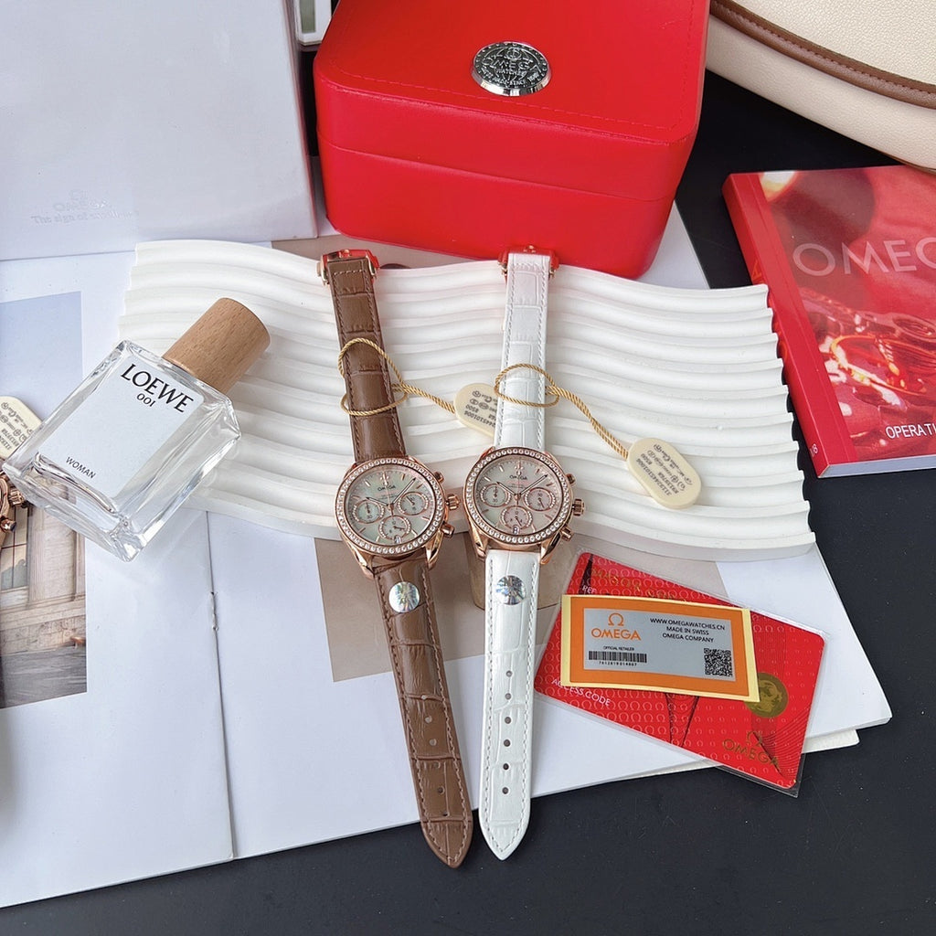 Omega watches with brown and white leather straps, rose-gold round dials with subdials