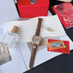 Omega watch with brown leather strap and rose-gold case; round silver dial