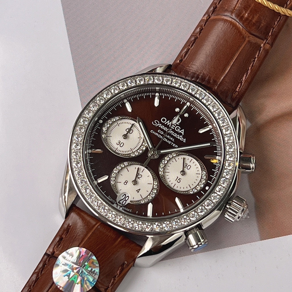 Omega watch, brown leather strap, jeweled bezel, black dial with three subdials