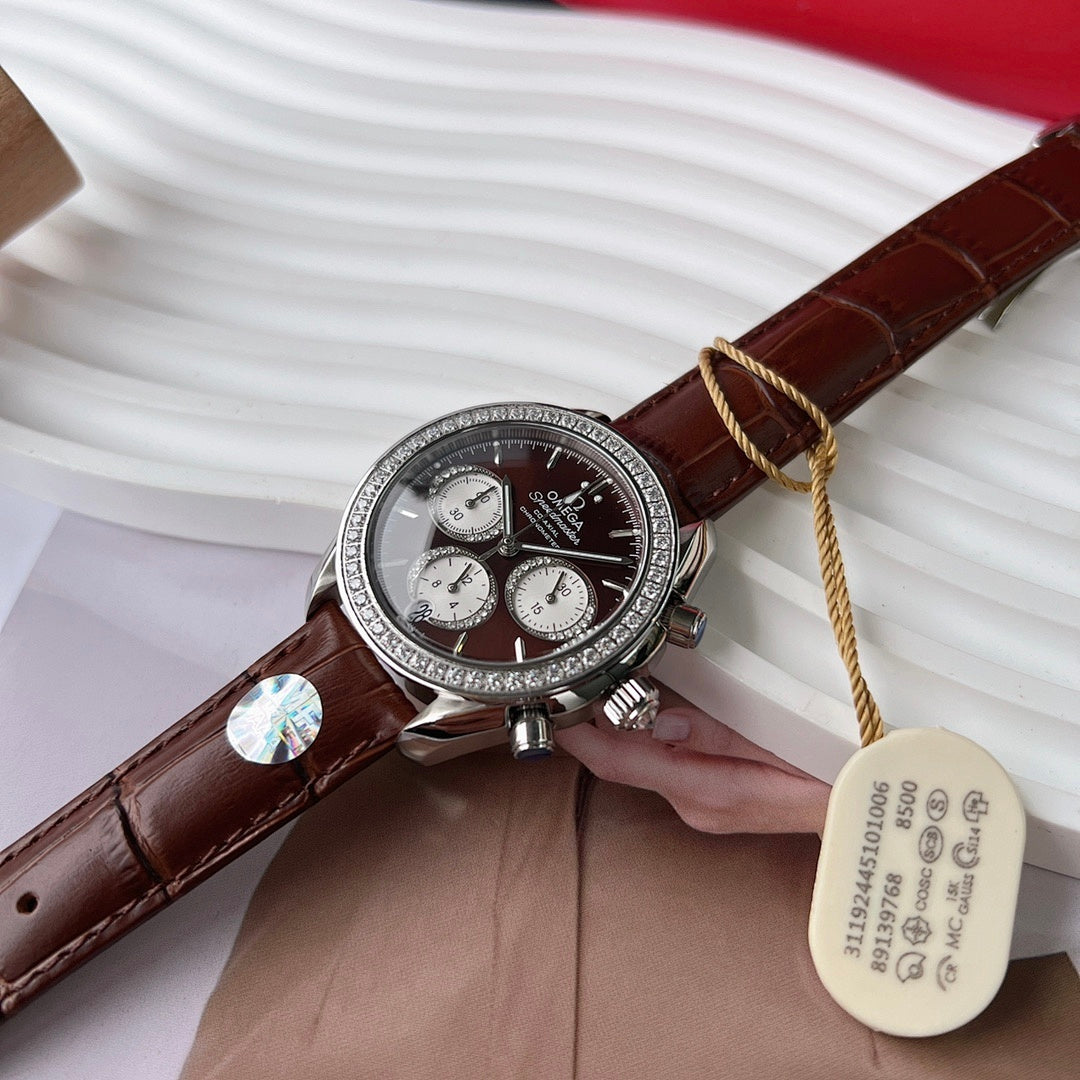 Chronograph watch with brown leather strap, silver case and black dial, subdials visible