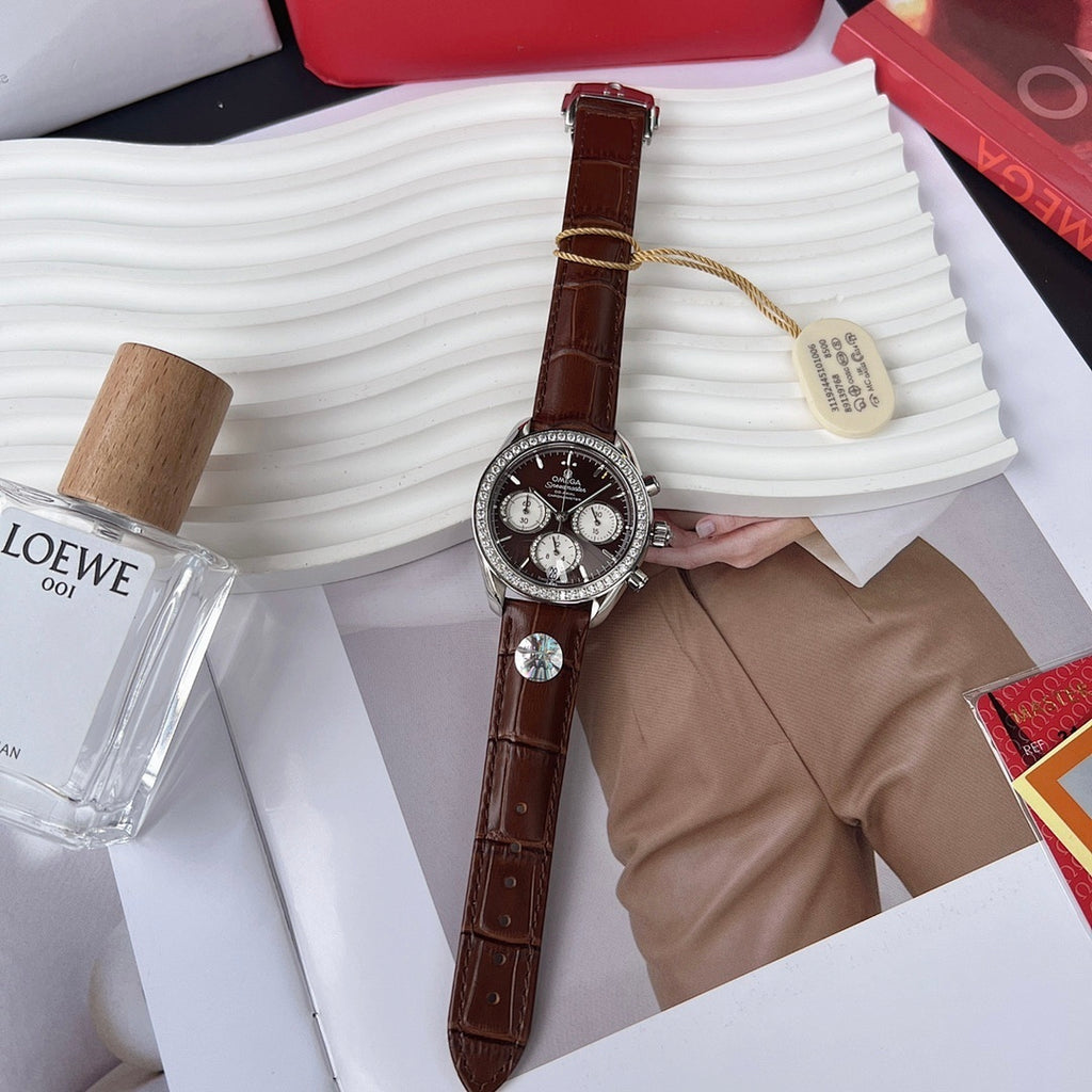 Chronograph watch with brown leather strap, jeweled bezel, black dial and subdials