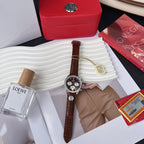 Chronograph watch with brown leather strap, silver chronograph dial, side pushers visible