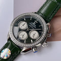Omega watch with green leather strap, diamond bezel, black chronograph dial and subdials