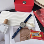 Omega wristwatch with blue leather strap and silver dial with three subdials