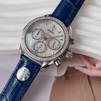 Omega wristwatch with blue leather strap, silver dial, diamond bezel