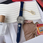 Omega wristwatch with blue leather strap, silver dial, visible crown and pushers