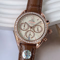 Omega chronograph watch with brown leather strap, rose-gold case, crystal bezel, white dial