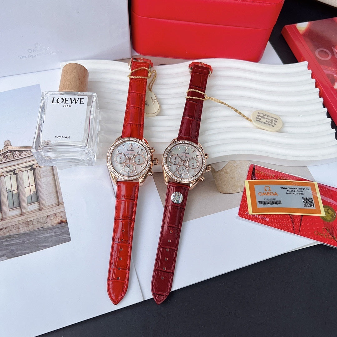Two red leather strap wristwatches with round white dials and gold-toned cases