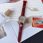 Round wristwatch with red leather strap, rose-gold bezel, and white chronograph dial