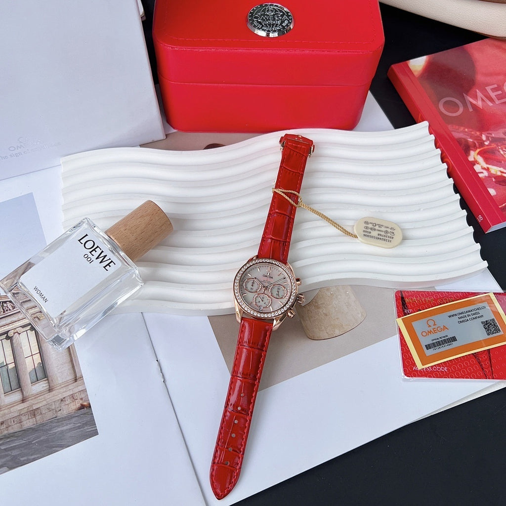 Red leather strap wristwatch with round silver bezel and visible crown, analog dial