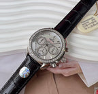 Omega chronograph watch with black leather strap, jeweled silver bezel, silver dial.