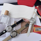 Omega chronograph watches with black and gray leather straps, silver jeweled cases.