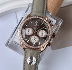 Omega chronograph wristwatch with dark dial, rose gold case, diamond-studded bezel, gray leather strap
