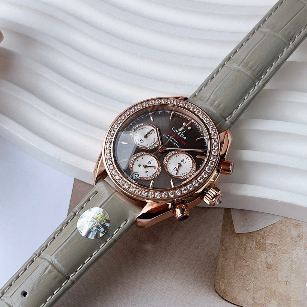 Omega chronograph wristwatch side angle, diamond bezel, dark dial, gray leather strap