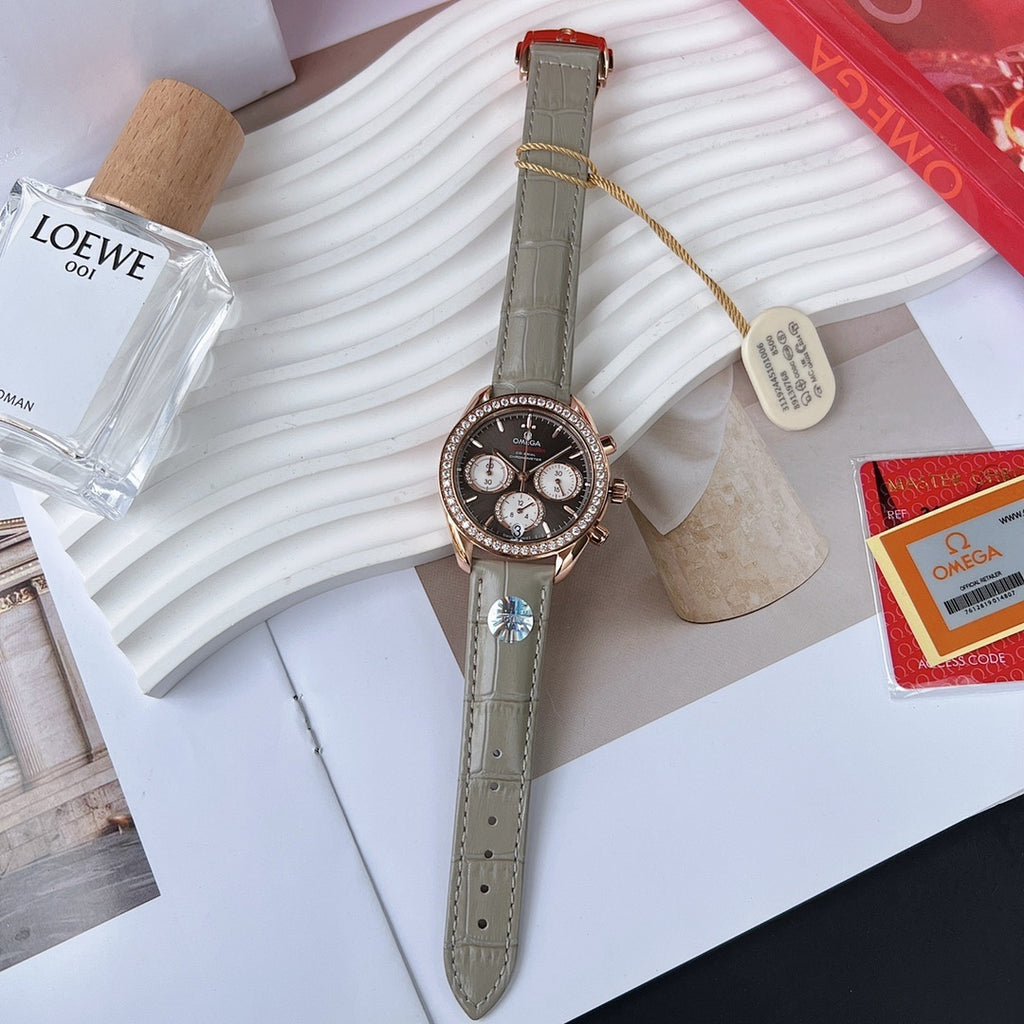 Omega watch with round dark dial, chronograph subdials, green leather strap