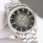 Omega wristwatch close-up, dark dial with numerals, silver bezel and watch hands.