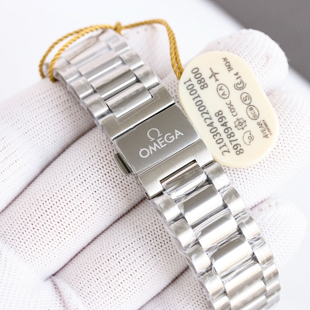 Omega wristwatch caseback with engraving, silver bracelet, hanging cream tag.