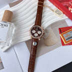 Omega watch close-up with brown leather strap, jeweled bezel, dark dial and white subdials.