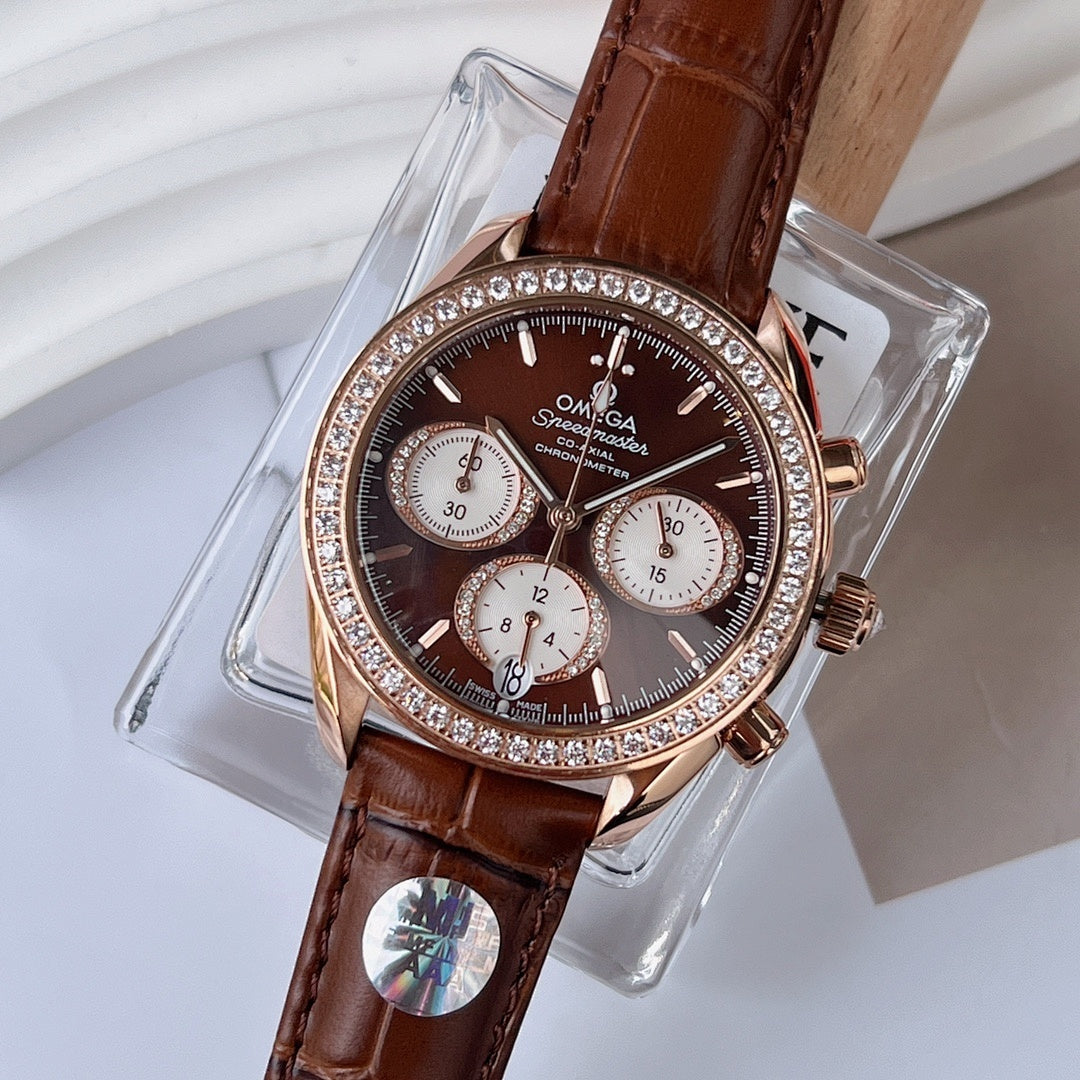 Omega watch with brown leather strap, jeweled bezel, dark dial chronograph subdials.