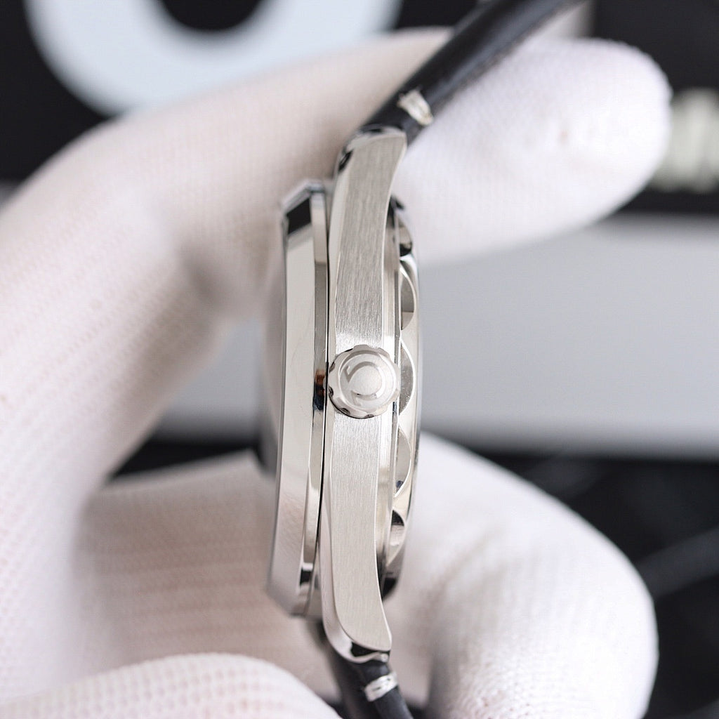 Omega wristwatch stainless steel case side with crown, close-up view.