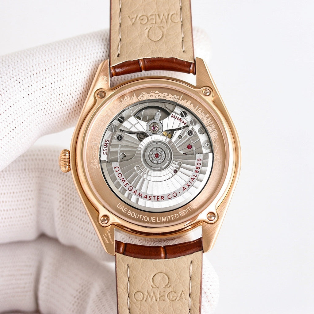 Omega watch skeleton display, rose-gold case, brown leather strap
