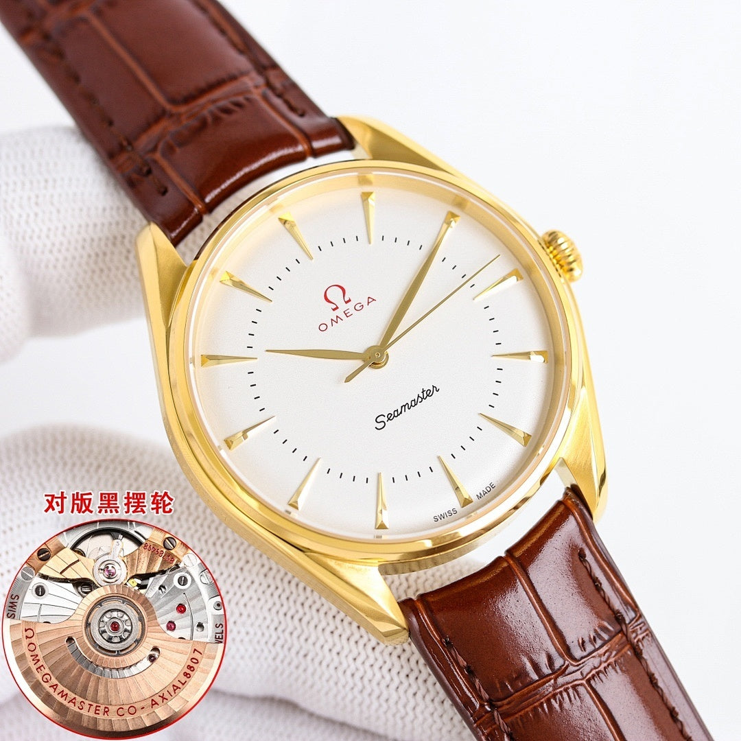 Gold Seamaster wristwatch with white dial and brown leather strap, angled view